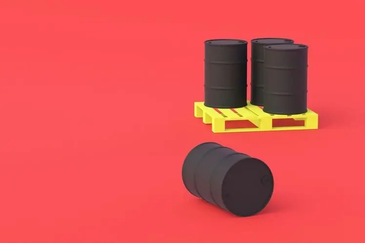 biggest drop in oil prices since November represented by a picture of two black oil barrels on the red background