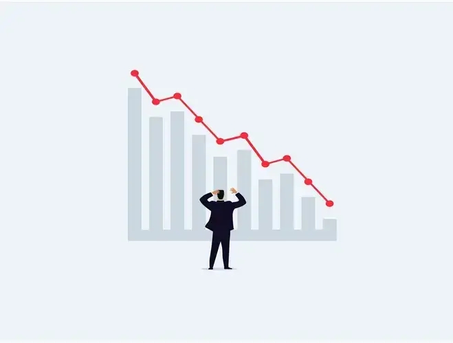 a man looking at the graph indicating an approaching economic recession and stagflation.