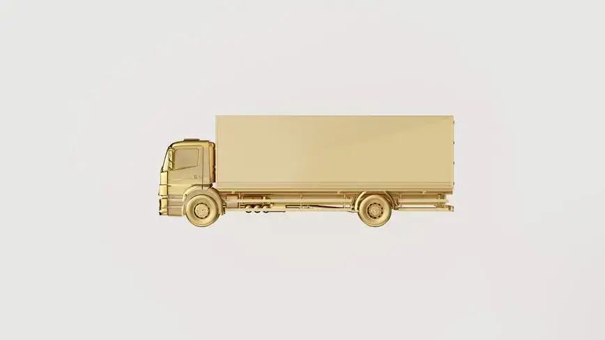 ein LKW aus Gold auf weißem Hintergrund, der physische Goldlieferungen repräsentiert