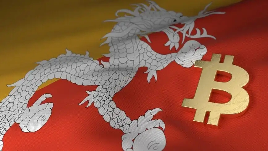 symbole en or du bitcoin posé sur un drapeau du Bhoutan