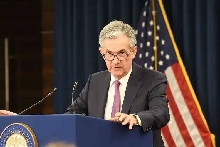 jerome powell giving a speech after being reappointed as fed chair