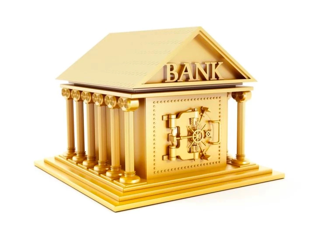 Central bank gold buying represented in a picture of a golden bank building with columns and a built-in secure vault 