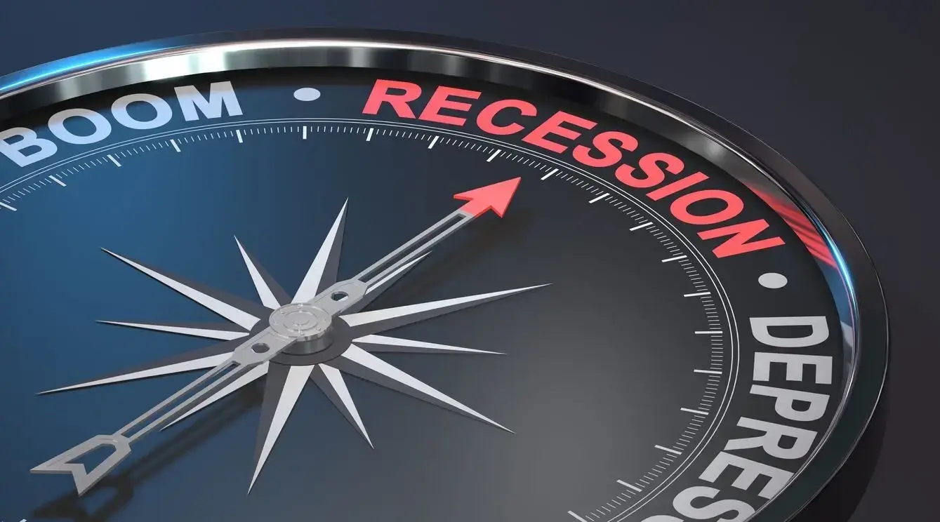 A possibility of the U.S. falling into recession represented by a picture of a compass pointing to “recession”