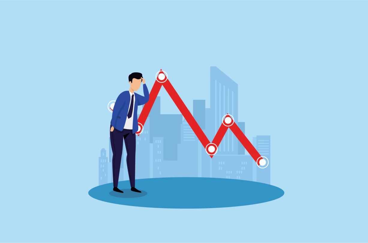 Steigende Inflation und unsichere Wirtschaftsaussichten drückten den Wert von Aktien und Kryptowährungen nach unten, wie das Bild eines Mannes in einem blauen Anzug zeigt, der auf die rote Kurve schaut, die nach unten geht