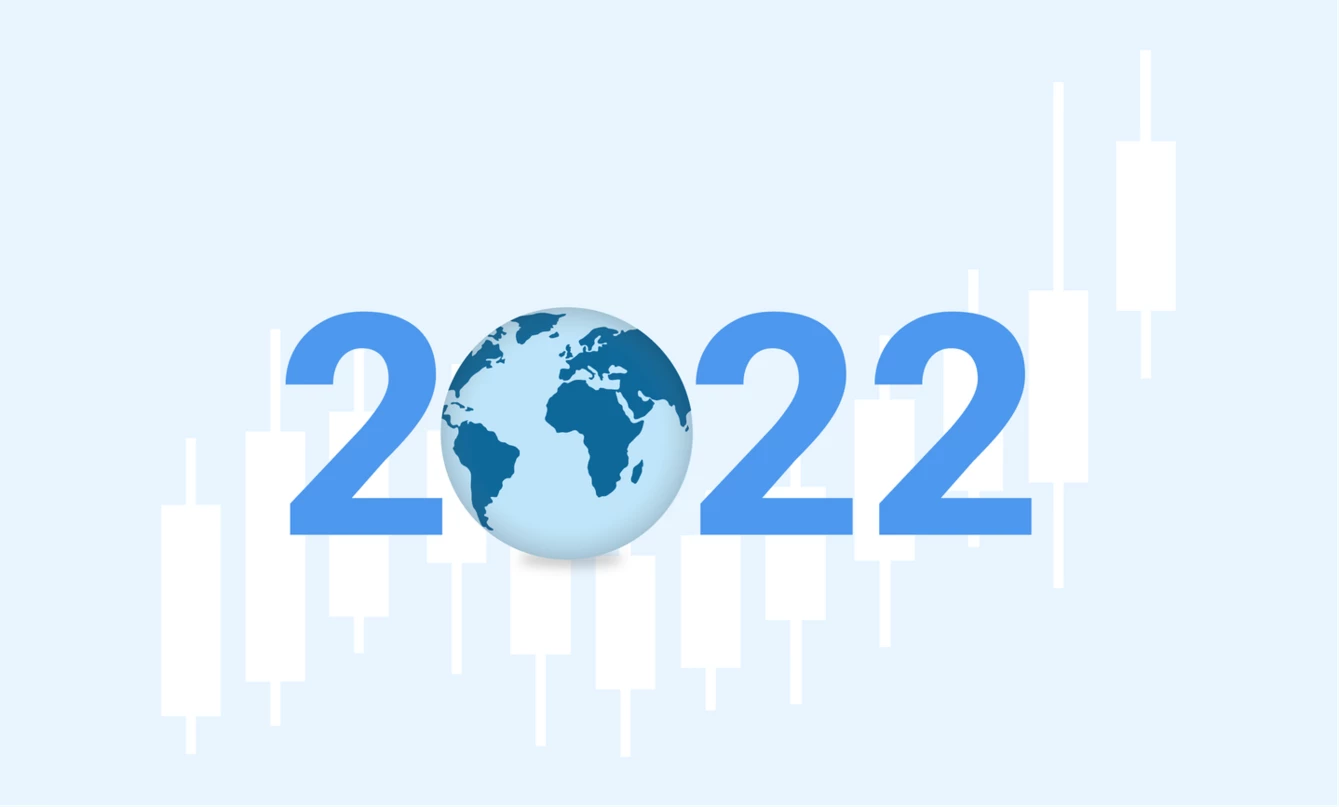 Un’immagine dell’anno 2022 con un mappamondo e indicatori economici sullo sfondo.