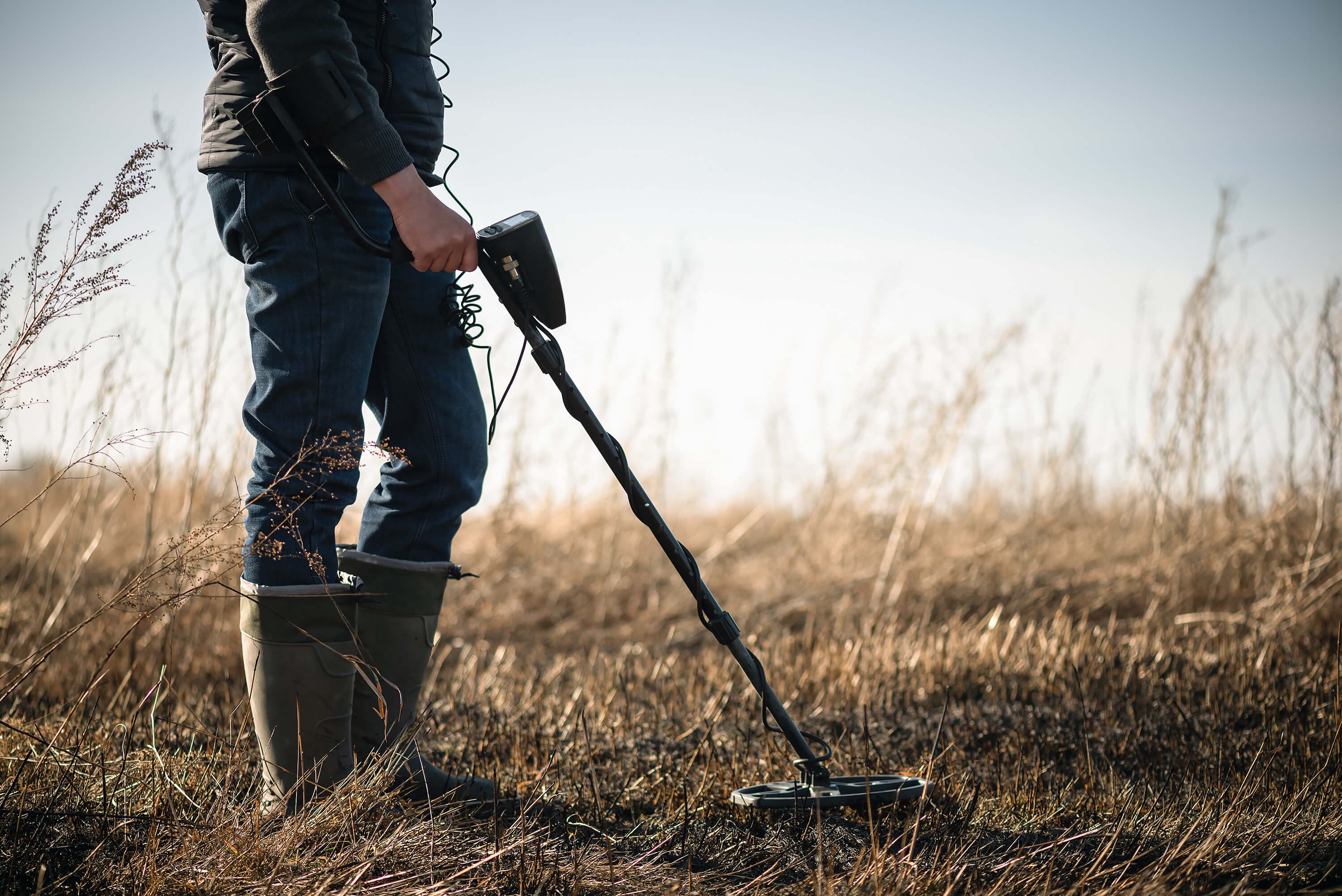 a man with metal detector a man with metal detector