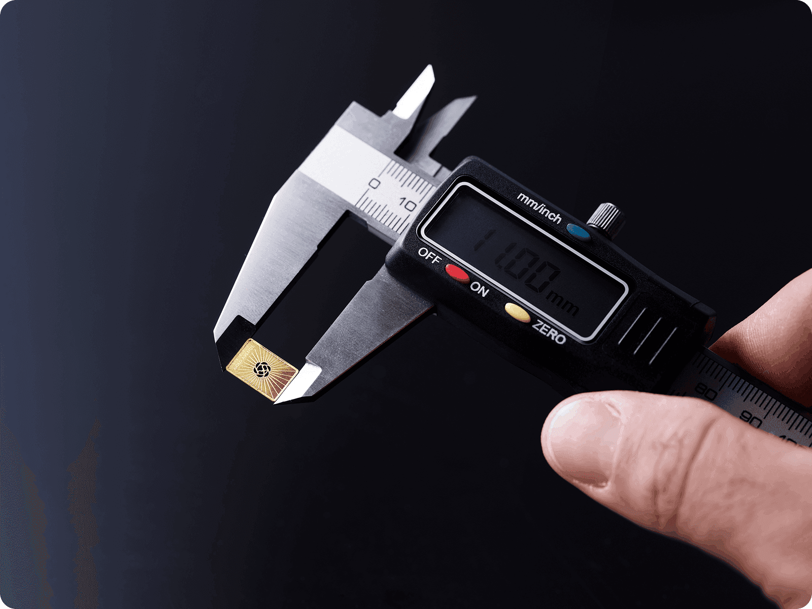 A 0.5 g gold bar being measured