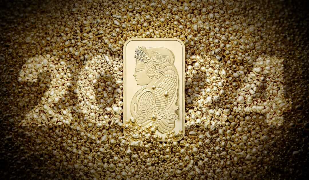 2024: Un brindisi a un anno d’oro! Il 2024 circondato dal bagliore di pepite d'oro e da una barra d'oro PAMP Lady Fortuna.