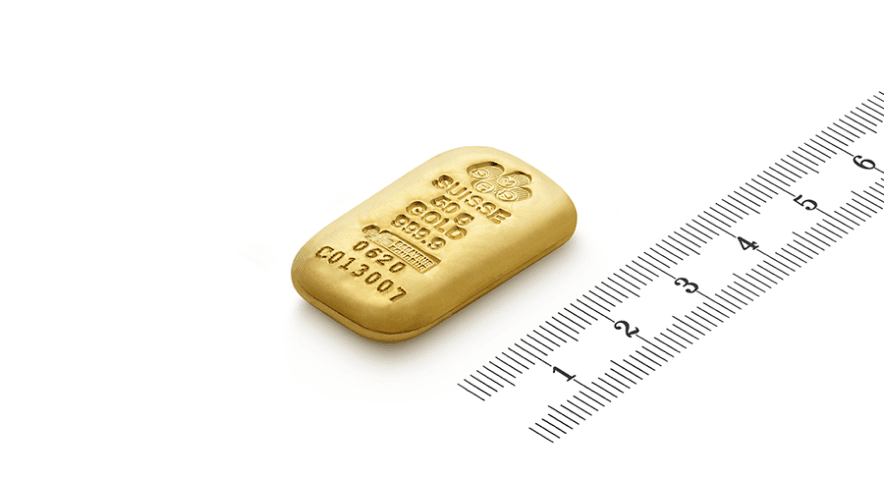 Lingot d'or PAMP Suisse avec une règle Lingot d'or PAMP Suisse avec une règle