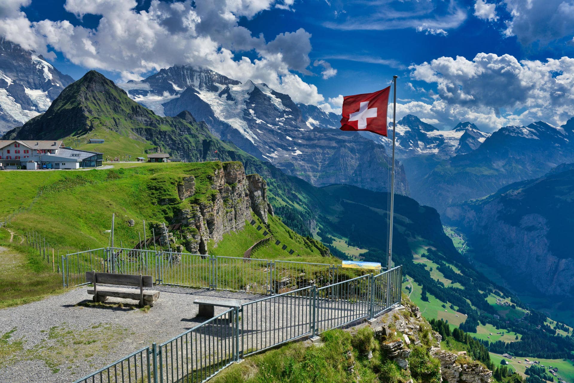 A swiss flag on a mountain A swiss flag on a mountain