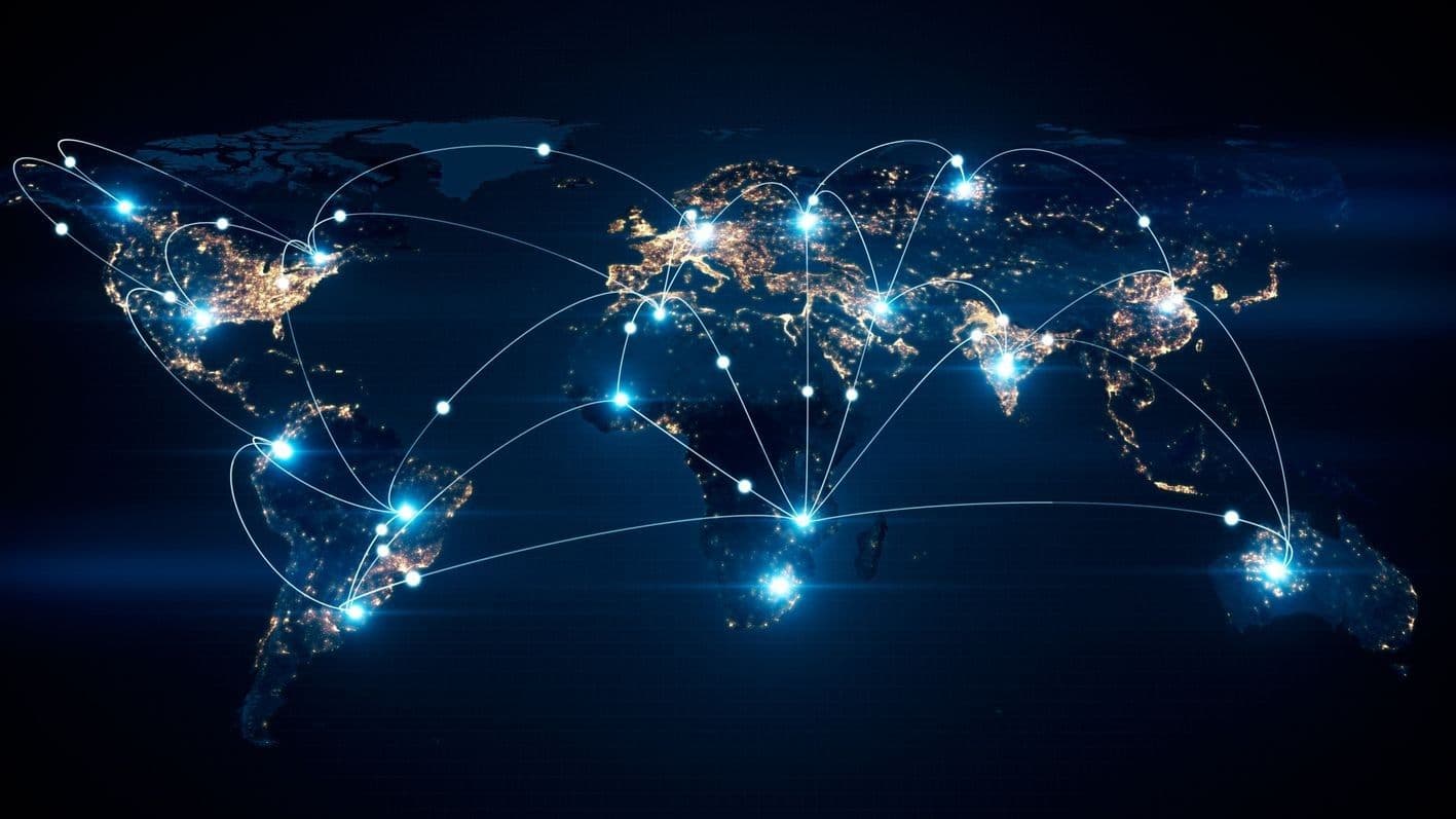 A world map depicted with silver lines connecting various countries. A world map depicted with silver lines connecting various countries.