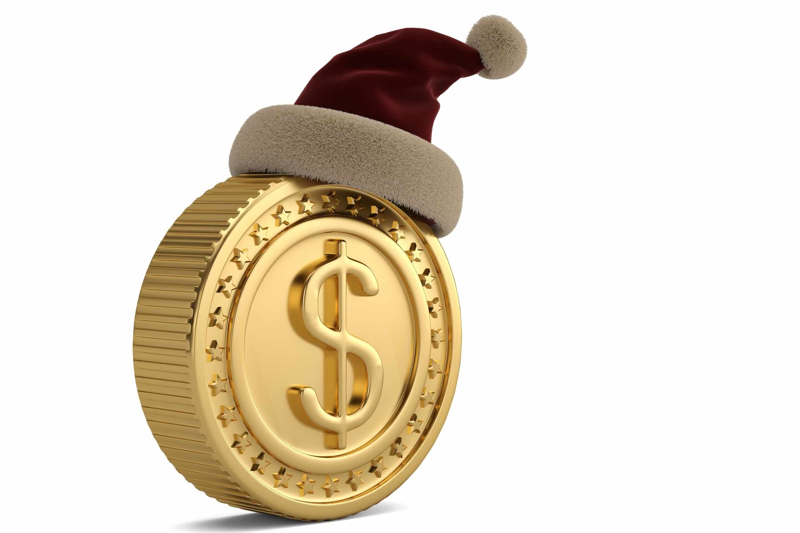 a gold coin with a U.S. dollar sign on it and a red Santa hat on top a gold coin with a U.S. dollar sign on it and a red Santa hat on top