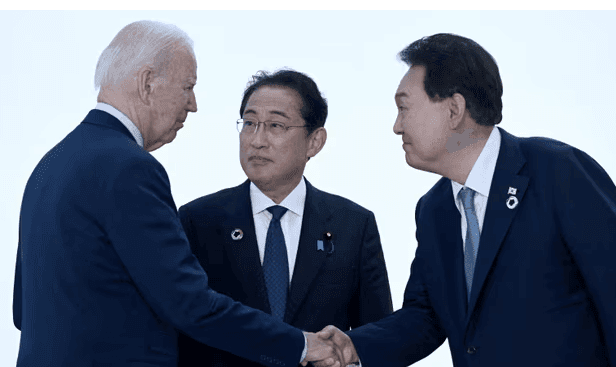 US president Joe Biden, Japan's prime minister Fumio Kishida and South Korea's president Yoon Suk Yeol greet each other. US president Joe Biden, Japan's prime minister Fumio Kishida and South Korea's president Yoon Suk Yeol greet each other.