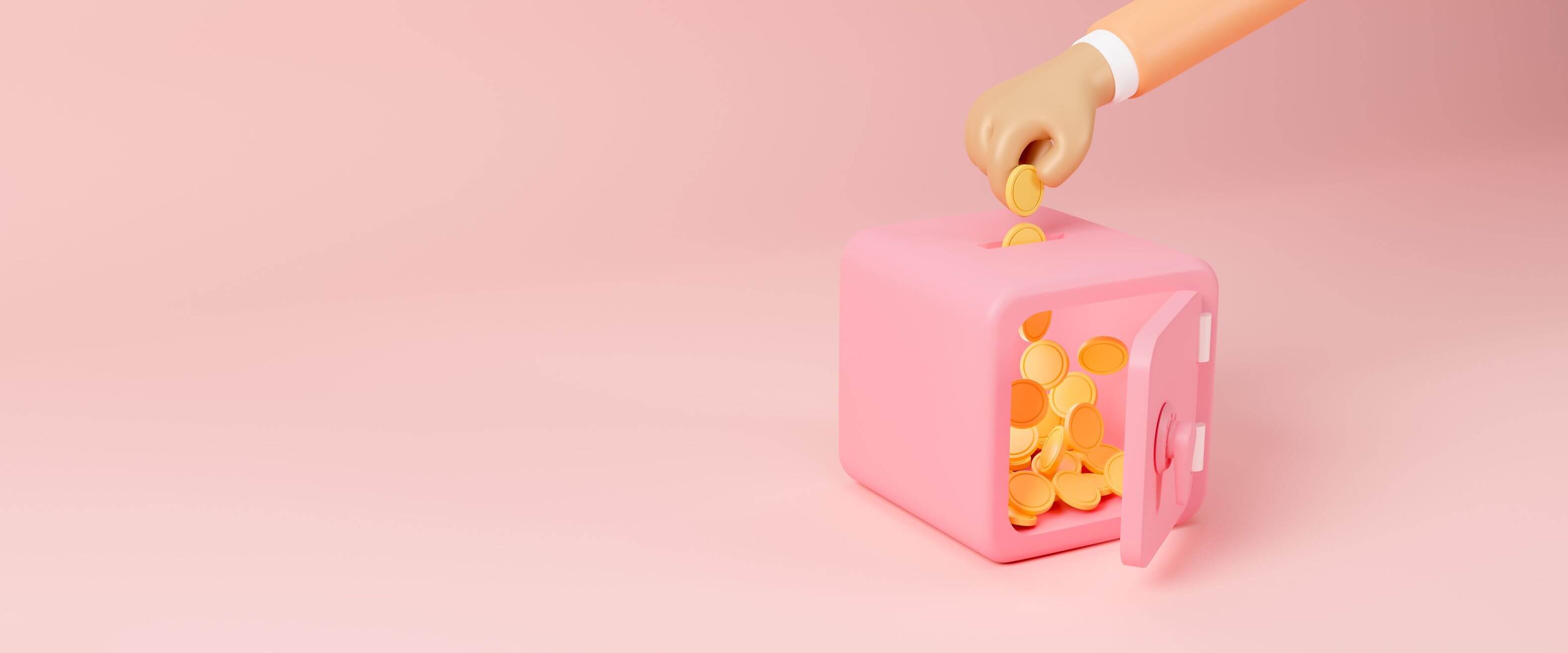 Una mano inserisce monete d’oro in una cassaforte rosa su sfondo rosa. Una mano inserisce monete d’oro in una cassaforte rosa su sfondo rosa.