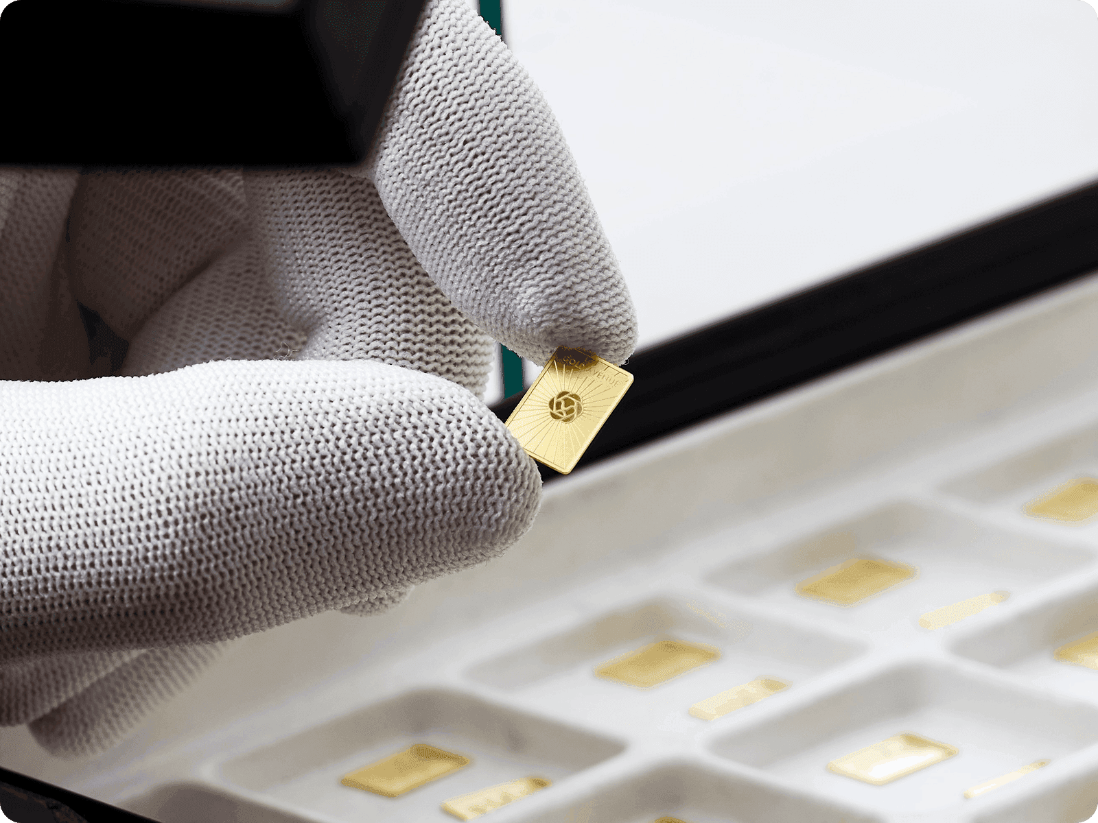 A 0.5 g gold bar being inspected