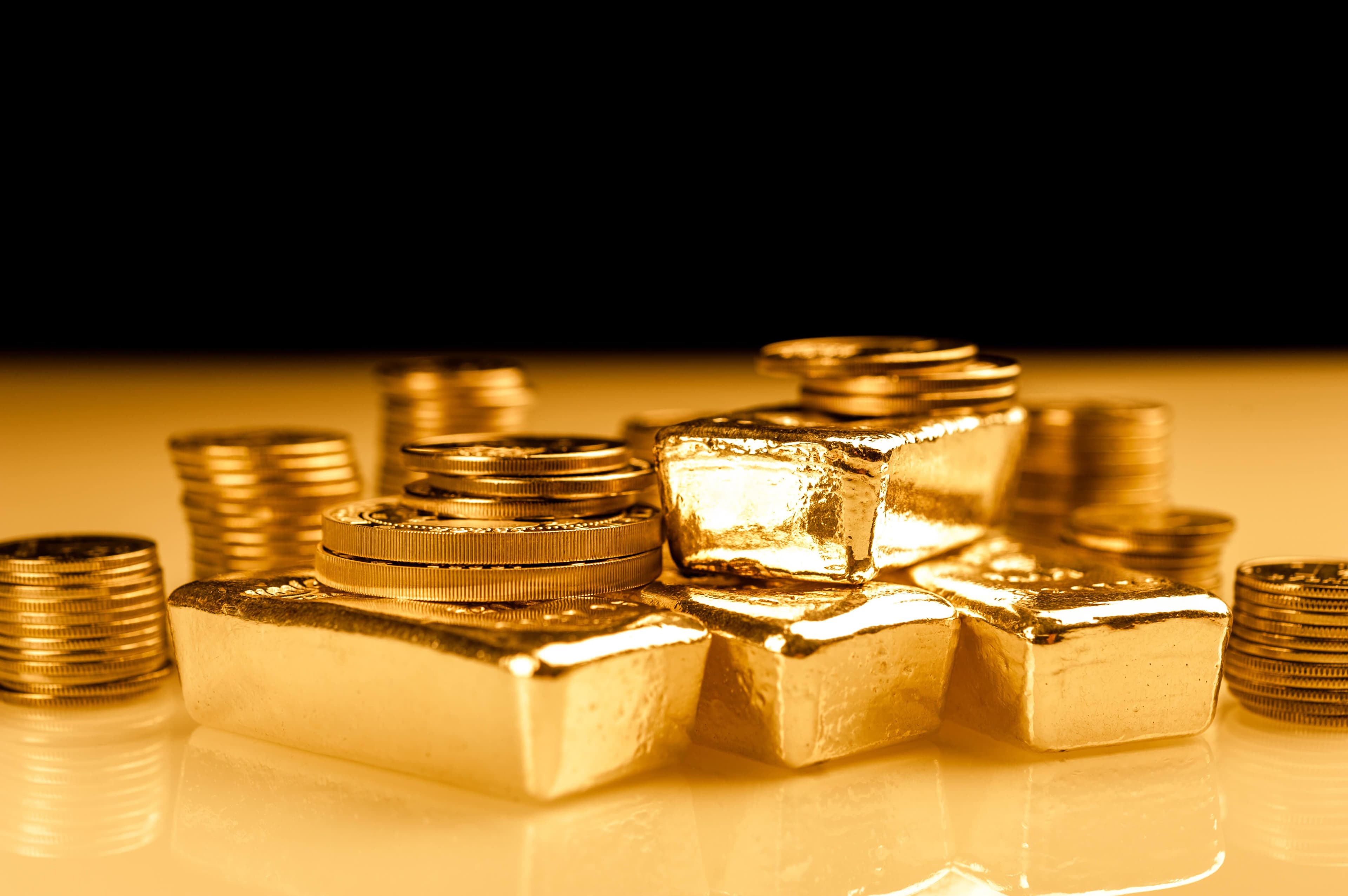 Goldbarren und Münzen Goldbarren und Münzen
